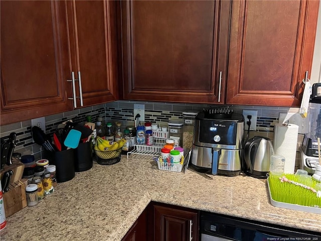 6651 Brookshire St, Fayetteville, NC 28314 - kitchen view of decorative backsplash, dishwasher, and light stone countertops