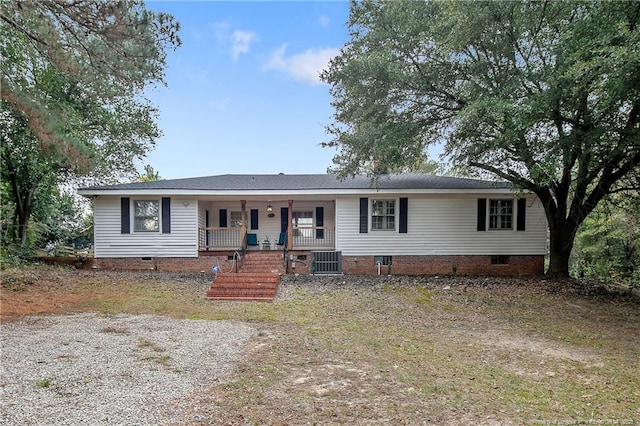single story home with covered porch, cooling unit, crawl space, and stairway