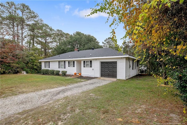 ranch-style house with a garage, gravel driveway, a front yard, and a chimney