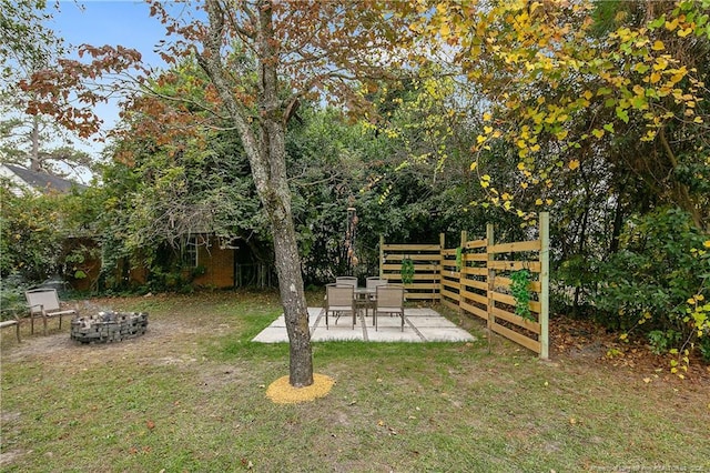 view of yard featuring a fire pit and a patio area