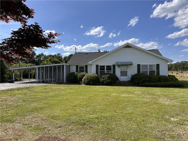 6695 Maxwell Rd, Stedman, NC 28391 - view of front facade with a carport, a front yard, and concrete driveway