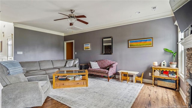 4323 Saleeby Way, Fayetteville, NC 28306 - living room featuring hardwood / wood-style flooring, a ceiling fan, ornamental molding, baseboards, and a fireplace