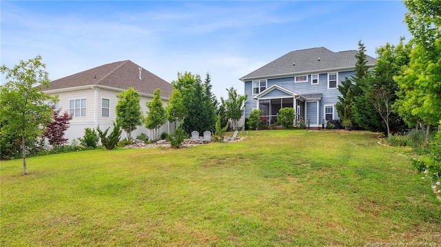 4323 Saleeby Way, Fayetteville, NC 28306 - back of house with a lawn and a sunroom