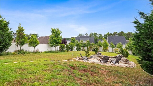 4323 Saleeby Way, Fayetteville, NC 28306 - view of yard featuring an outdoor fire pit