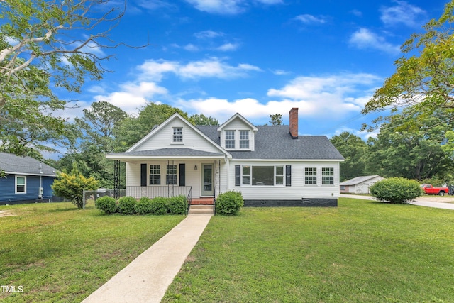 302 Hester St, Knightdale, NC 27545 - view of front of property featuring a porch, a chimney, and a front yard