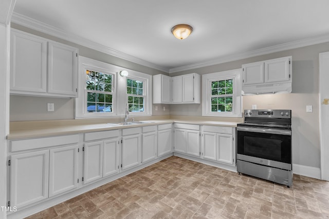 302 Hester St, Knightdale, NC 27545 - kitchen with electric range, under cabinet range hood, brick patterned floors, white cabinets, and ornamental molding