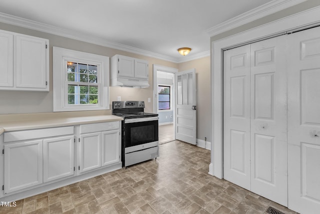 302 Hester St, Knightdale, NC 27545 - kitchen with electric range, under cabinet range hood, brick patterned floors, plenty of natural light, and crown molding