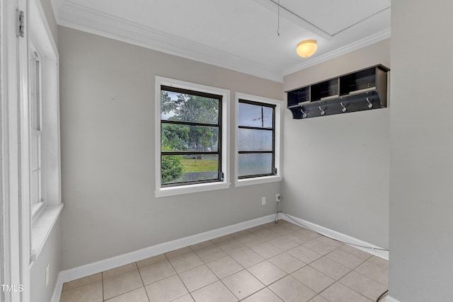 302 Hester St, Knightdale, NC 27545 - empty room with crown molding, light tile patterned floors, and baseboards