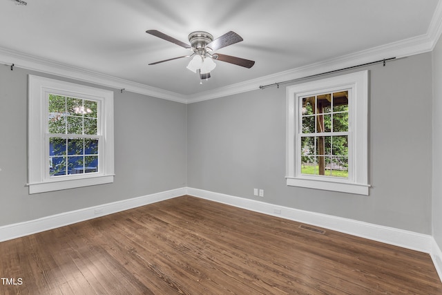302 Hester St, Knightdale, NC 27545 - unfurnished room with plenty of natural light, crown molding, baseboards, ceiling fan, and dark wood-style floors