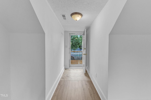 302 Hester St, Knightdale, NC 27545 - corridor featuring a textured ceiling, wood finished floors, and baseboards