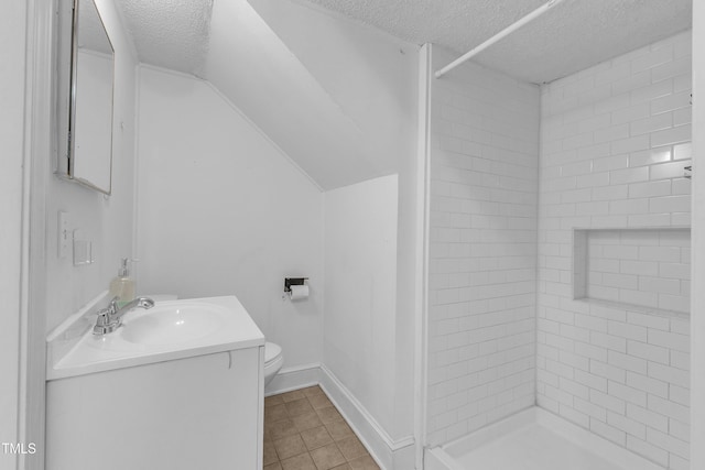 302 Hester St, Knightdale, NC 27545 - full bathroom with a textured ceiling, toilet, tile patterned flooring, vanity, and a shower