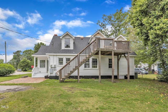 302 Hester St, Knightdale, NC 27545 - rear view of property featuring stairway, a deck, a lawn, and roof with shingles