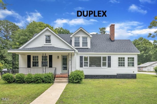 302 Hester St, Knightdale, NC 27545 - view of front of property featuring a front yard and a shingled roof