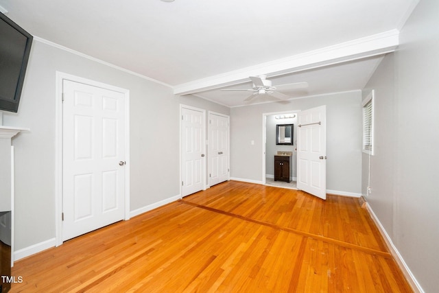 unfurnished bedroom with light wood-style floors, baseboards, ensuite bath, ceiling fan, and crown molding