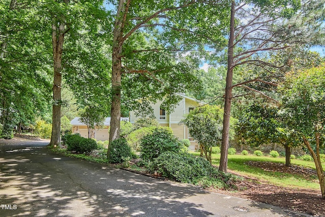 view of side of property with driveway