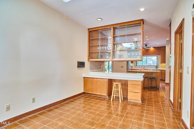 bar featuring recessed lighting, baseboards, and light tile patterned floors