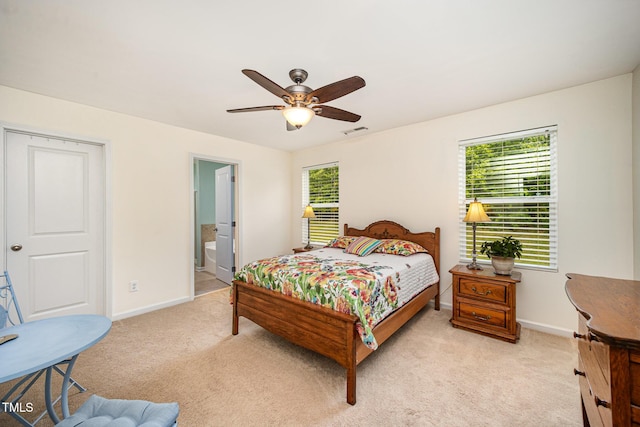 3403 Cardinal Lake Dr, Durham, NC 27704 - bedroom featuring light colored carpet, baseboards, a ceiling fan, and connected bathroom