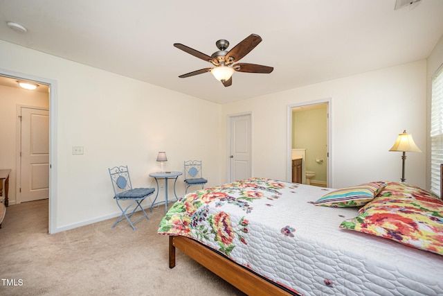 3403 Cardinal Lake Dr, Durham, NC 27704 - bedroom with light carpet, baseboards, ensuite bathroom, and a ceiling fan