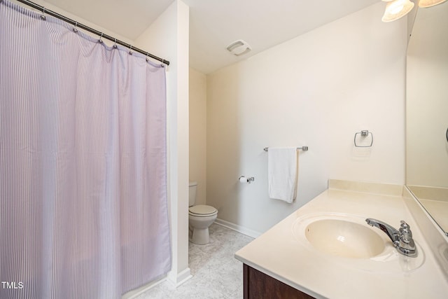 3403 Cardinal Lake Dr, Durham, NC 27704 - full bathroom featuring vanity, toilet, curtained shower, and baseboards