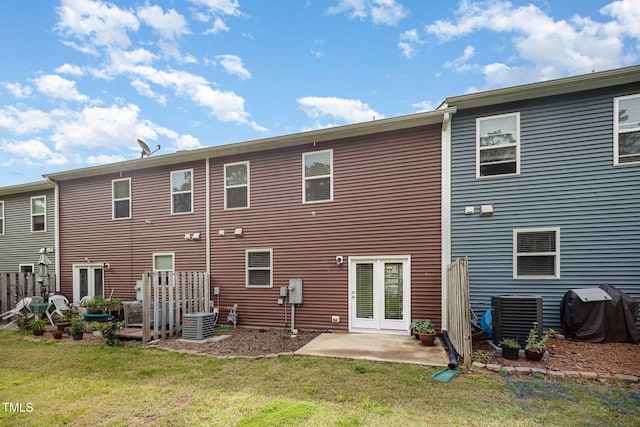 3403 Cardinal Lake Dr, Durham, NC 27704 - rear view of property featuring a yard, central AC, and a patio
