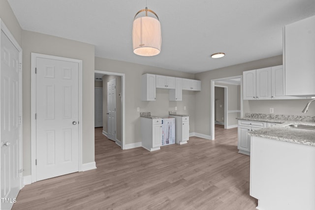 114 Lynnville Ct, Lillington, NC 27546 - kitchen featuring a sink, white cabinets, and light wood-style floors