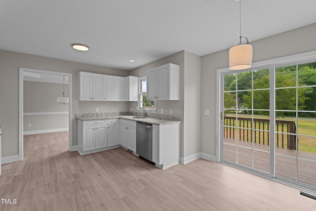 114 Lynnville Ct, Lillington, NC 27546 - kitchen with dishwasher, a sink, light wood-type flooring, baseboards, and white cabinets