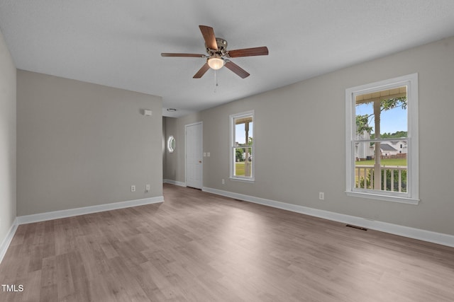 114 Lynnville Ct, Lillington, NC 27546 - spare room featuring a ceiling fan, light wood-style flooring, and baseboards
