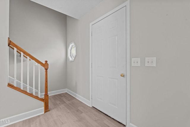 114 Lynnville Ct, Lillington, NC 27546 - entrance foyer with light wood-style floors, baseboards, and stairs