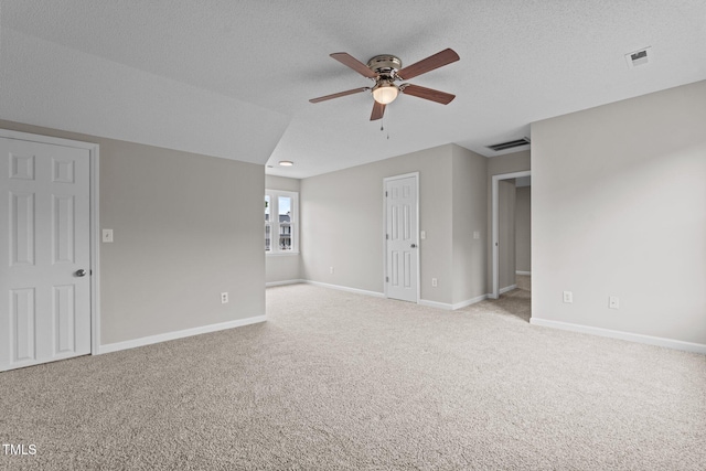 114 Lynnville Ct, Lillington, NC 27546 - empty room with ceiling fan, light colored carpet, baseboards, and a textured ceiling