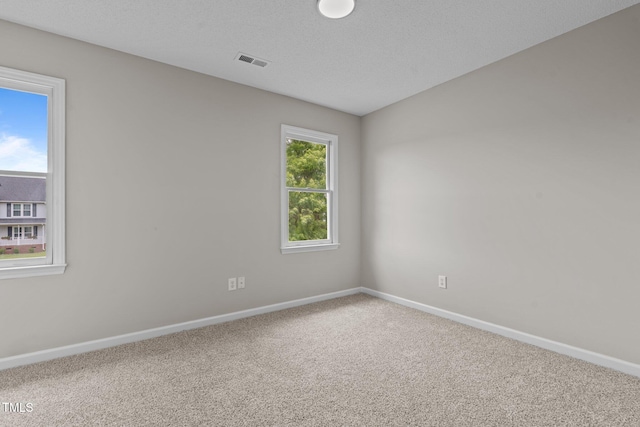114 Lynnville Ct, Lillington, NC 27546 - carpeted spare room featuring baseboards and a textured ceiling