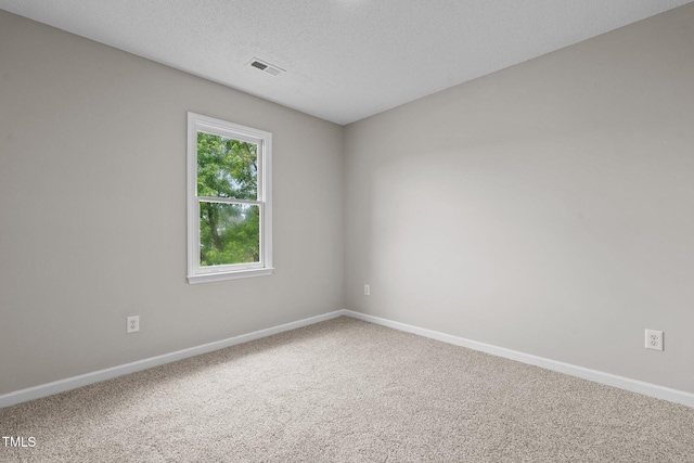 114 Lynnville Ct, Lillington, NC 27546 - unfurnished room with baseboards, carpet flooring, and a textured ceiling