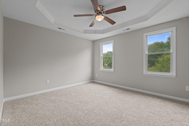 114 Lynnville Ct, Lillington, NC 27546 - empty room with a raised ceiling, carpet flooring, baseboards, ceiling fan, and ornamental molding