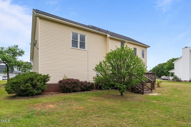 114 Lynnville Ct, Lillington, NC 27546 - view of home's exterior featuring a lawn