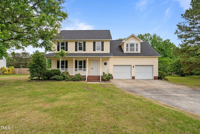 114 Lynnville Ct, Lillington, NC 27546 - colonial inspired home featuring a porch, concrete driveway, and an attached garage