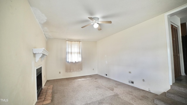 2121 Lombardy Dr, Fayetteville, NC 28304 - unfurnished living room featuring a ceiling fan, a fireplace, carpet, and baseboards