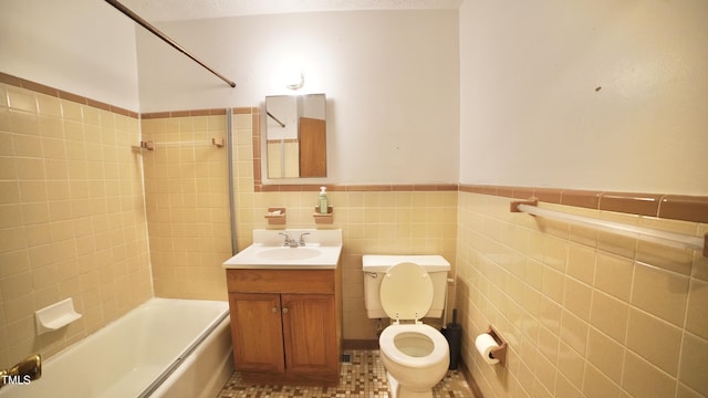 2121 Lombardy Dr, Fayetteville, NC 28304 - full bath with toilet, shower / tub combination, tile walls, a wainscoted wall, and vanity