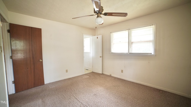 2121 Lombardy Dr, Fayetteville, NC 28304 - unfurnished bedroom featuring carpet flooring, baseboards, and ceiling fan