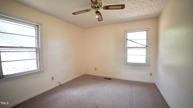 2121 Lombardy Dr, Fayetteville, NC 28304 - unfurnished room with plenty of natural light, carpet floors, a textured ceiling, and baseboards