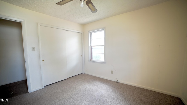 2121 Lombardy Dr, Fayetteville, NC 28304 - unfurnished bedroom featuring carpet, a closet, baseboards, a textured ceiling, and a ceiling fan