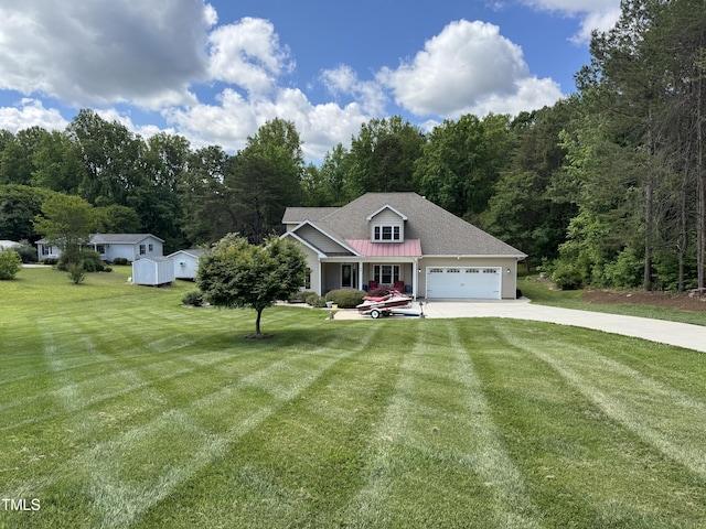 view of front facade featuring concrete driveway, a garage, a front yard, and a view of trees