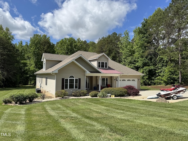 view of front of house featuring a garage, driveway, a porch, and a front lawn