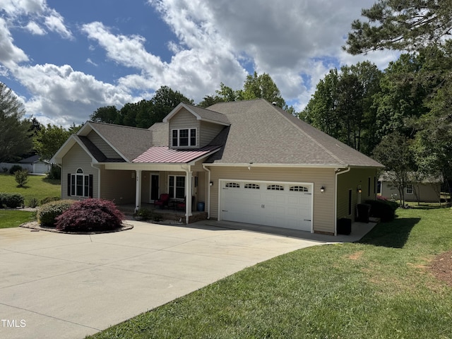 view of front facade with a garage, a porch, driveway, a front yard, and a shingled roof