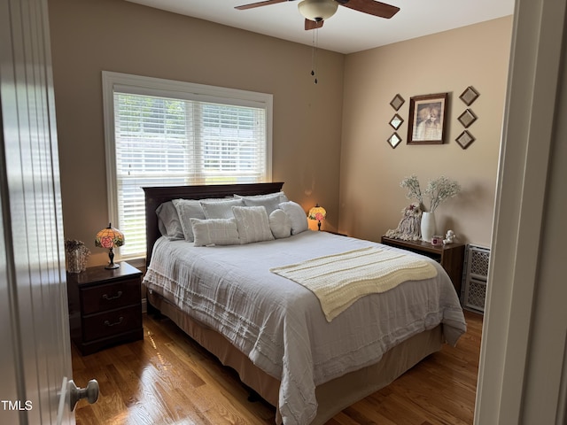 bedroom with wood finished floors and ceiling fan