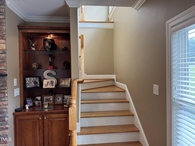 staircase with crown molding