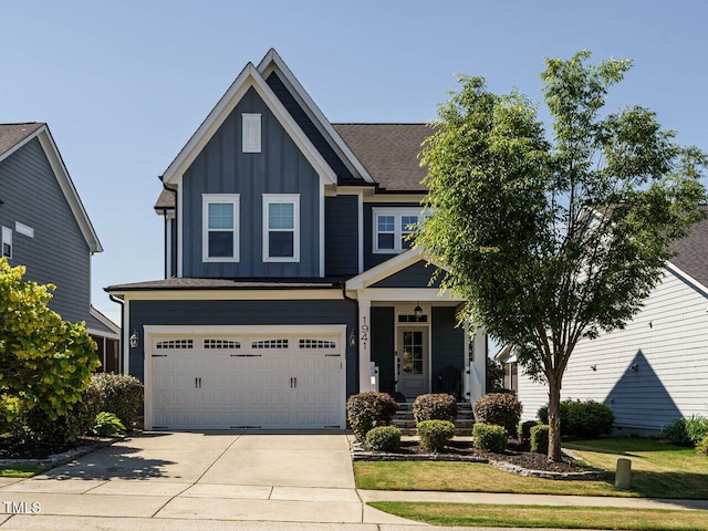 craftsman house with board and batten siding, concrete driveway, and a garage