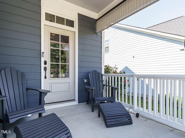 view of exterior entry with a porch