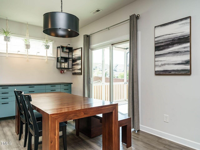 dining room with wood finished floors and baseboards