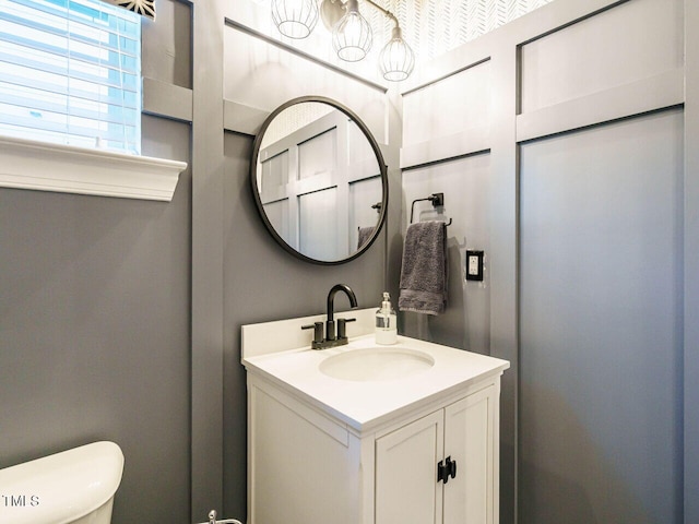 bathroom with vanity and toilet
