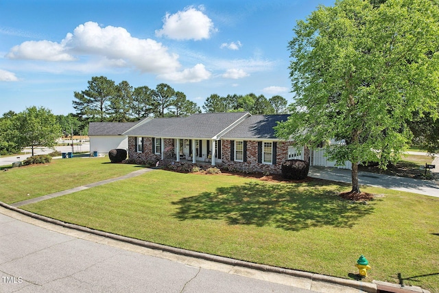 203 Marlowe Dr, Dunn, NC 28334 - single story home with driveway, brick siding, a front yard, and roof with shingles