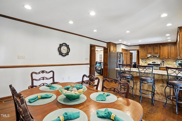203 Marlowe Dr, Dunn, NC 28334 - dining room featuring ornamental molding, dark wood-style floors, recessed lighting, and baseboards